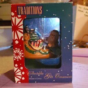 Vintage Christmas Tree Ornament Santa in Canoe